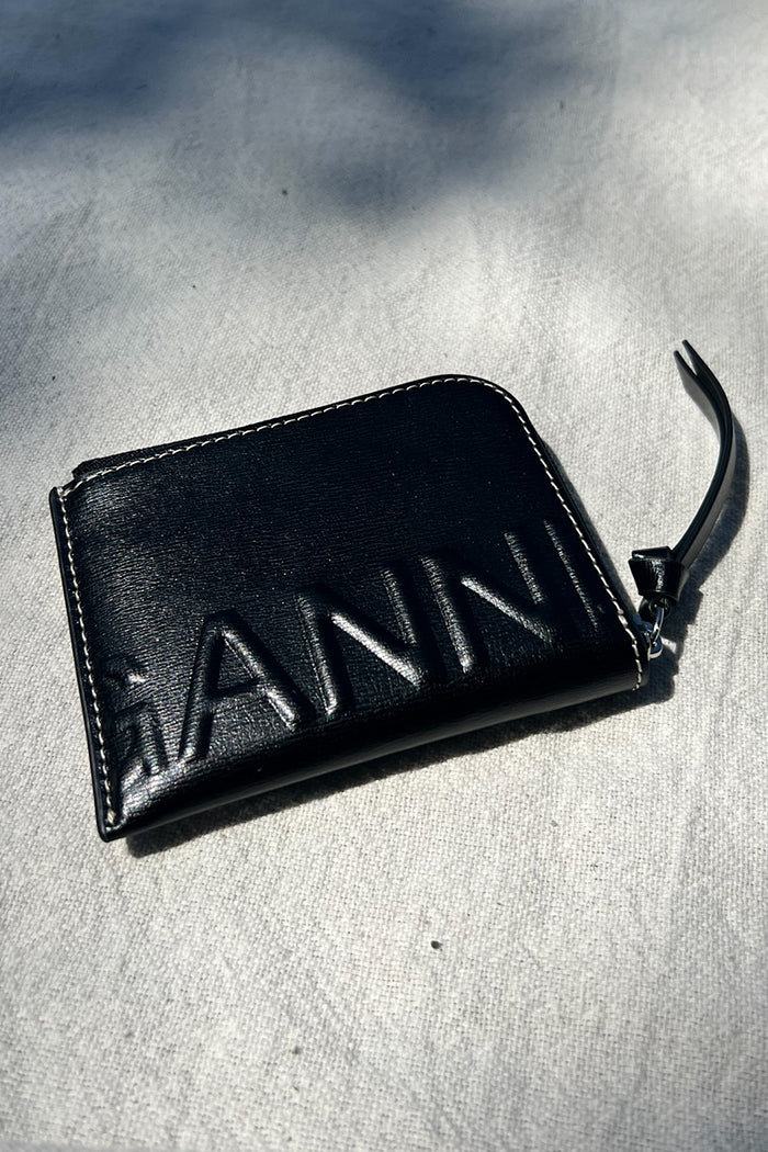 Ganni banner zip around wallet in black leather white stitching PIPE AND ROW