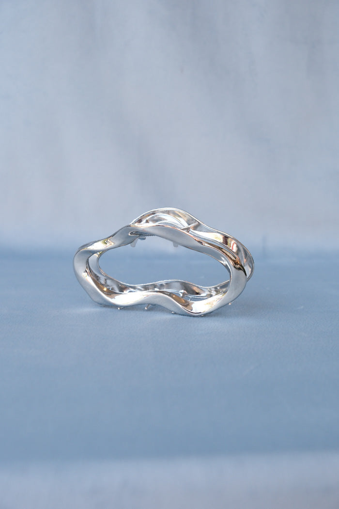 Large metal open oval hair claw in silver. PIPE AND ROW