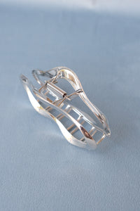 Large metal open oval hair claw in silver. PIPE AND ROW