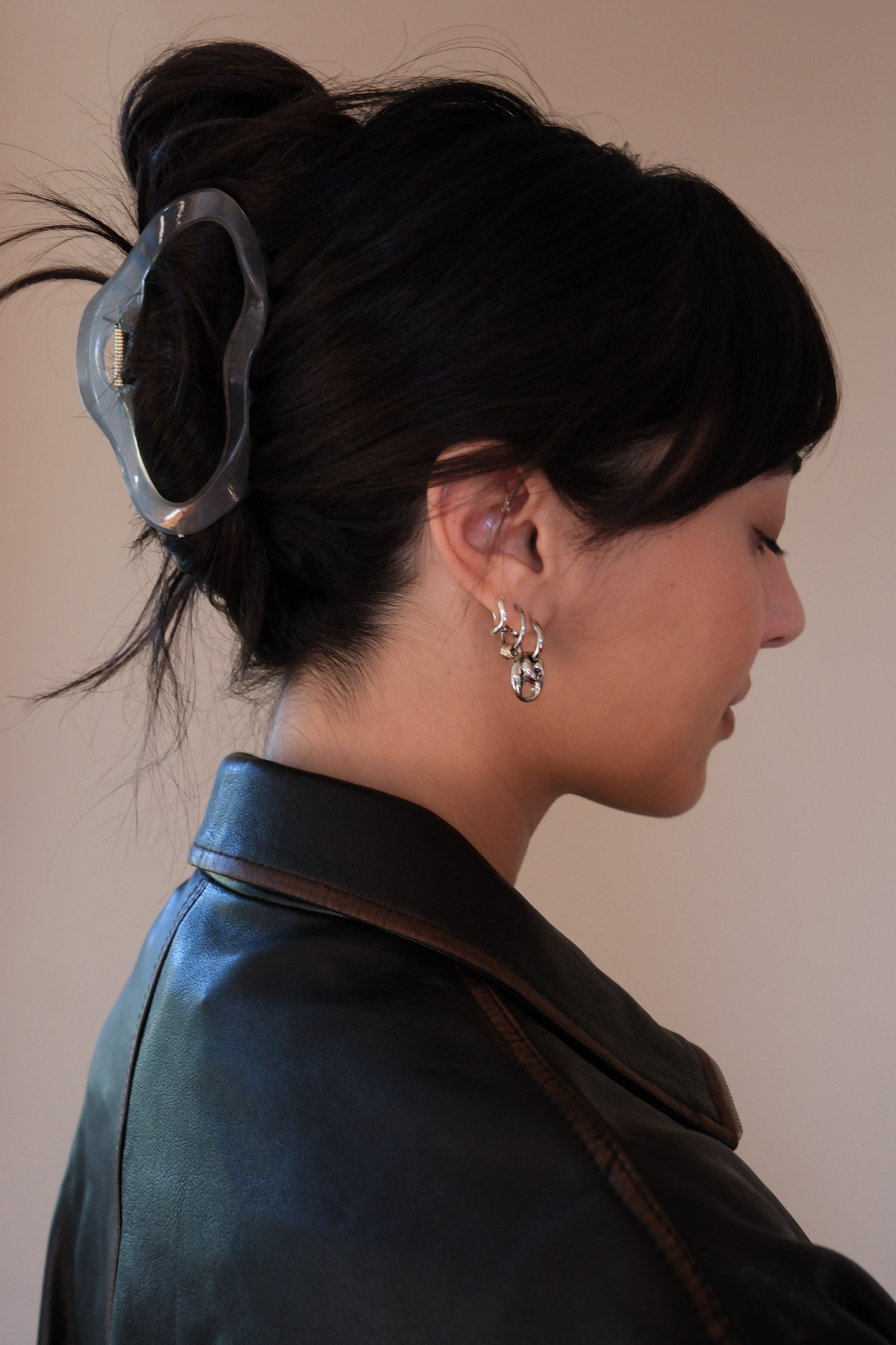Large open oval hair claw in sheer grey. PIPE AND ROW