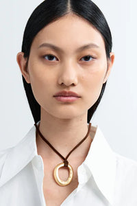 Heaven Mayhem mini necklace gold circular pendant rich brown cord | Pipe and Row