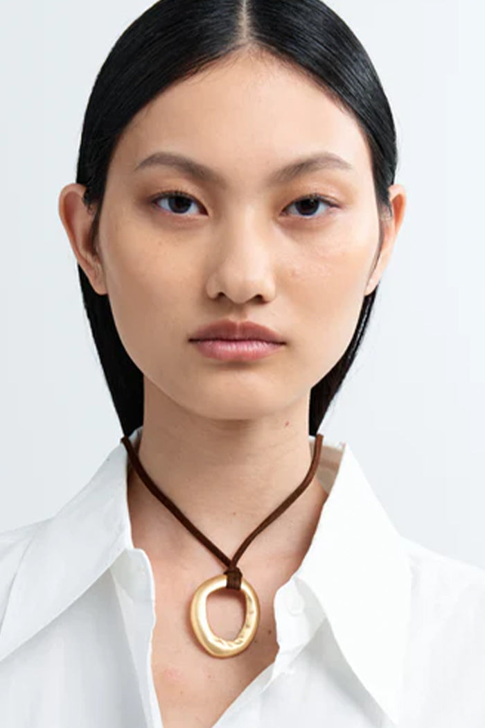 Heaven Mayhem mini necklace gold circular pendant rich brown cord | Pipe and Row