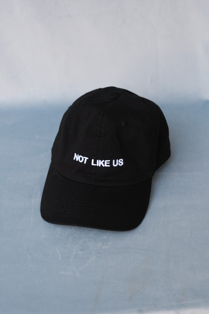 "Not like us" embroidered black dad hat PIPE AND ROW