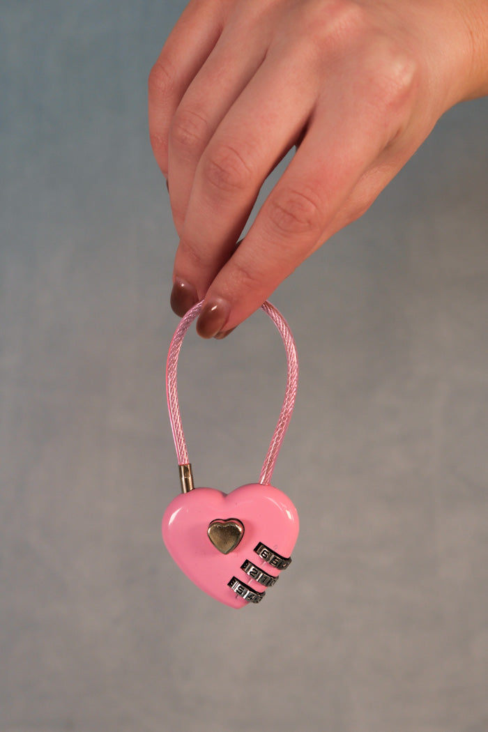Pink heart lock bag charm with silver hardware. PIPE AND ROW
