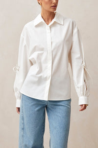 Alohas white button up Sugar shirt eyelet bow details on arms, and tie at back waist PIPE AND ROW