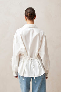 Alohas white button up Sugar shirt eyelet bow details on arms, and tie at back waist PIPE AND ROW