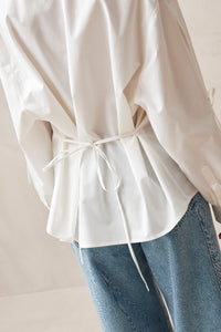 Alohas white button up Sugar shirt eyelet bow details on arms, and tie at back waist PIPE AND ROW