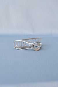 Triangle silver metal hair claw. PIPE AND ROW