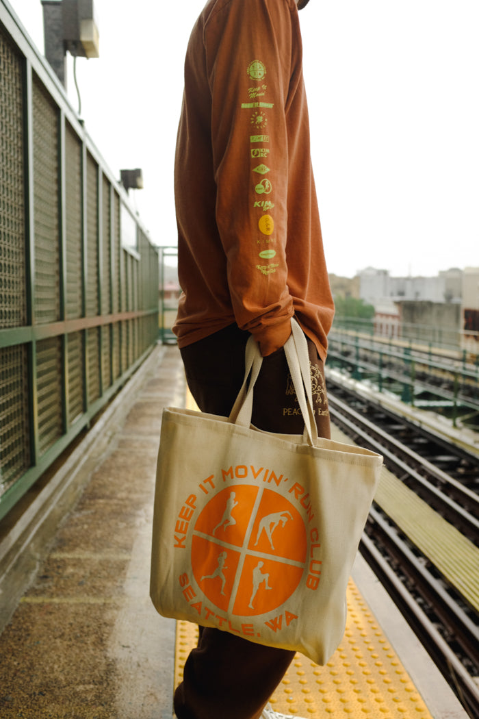 Keep it movin' warm up natural canvas tote orange | KIMRC Pipe and Row