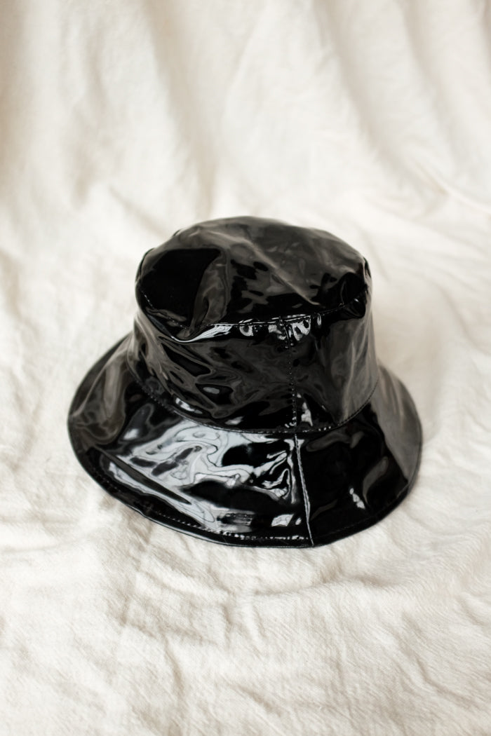 EJ Black patent bucket hat. 100% vegan material. PIPE AND ROW