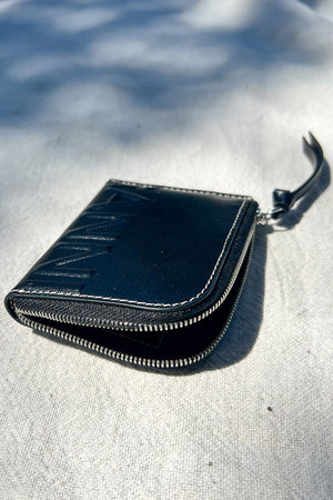 Ganni banner zip around wallet in black leather white stitching PIPE AND ROW